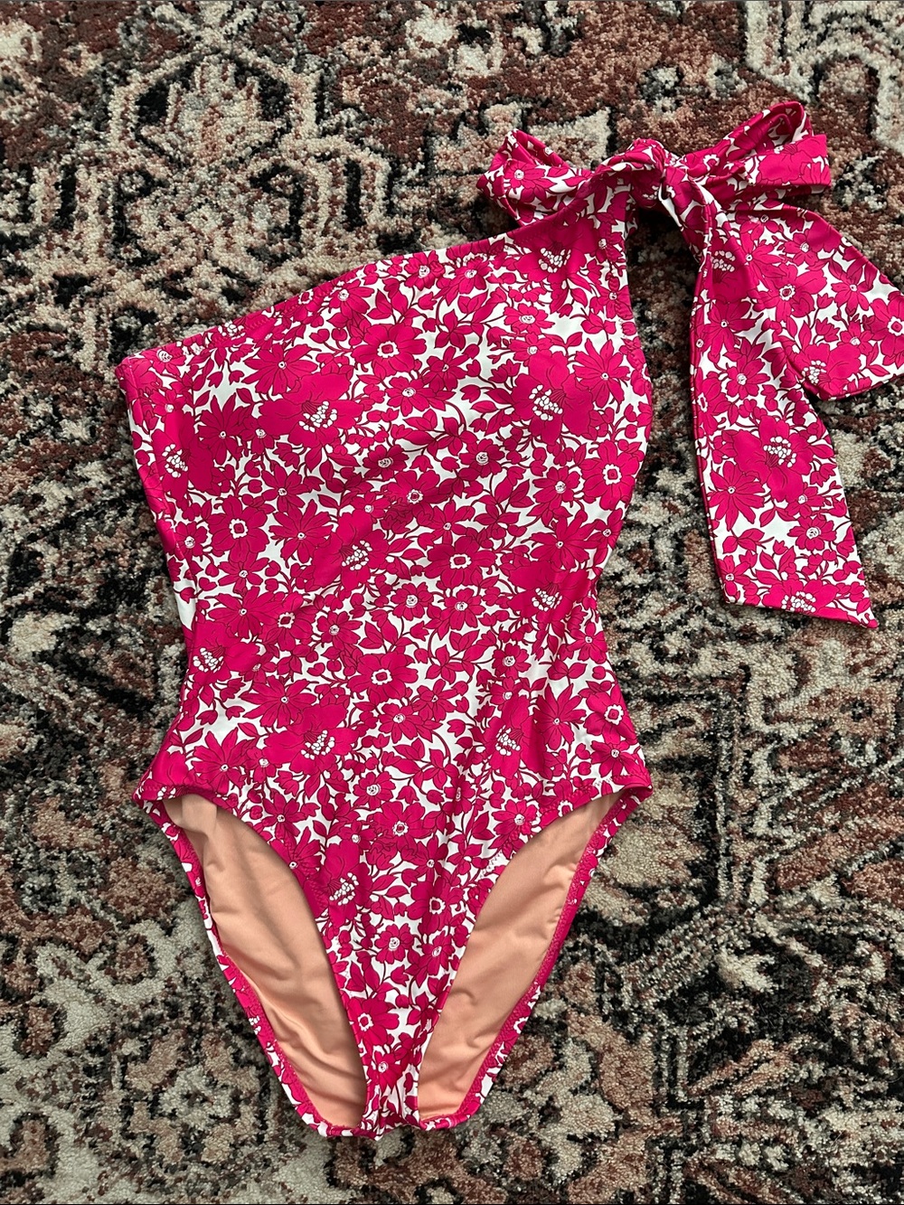 J. Crew One-Shoulder Floral Swimsuit in Hot Pink and White.